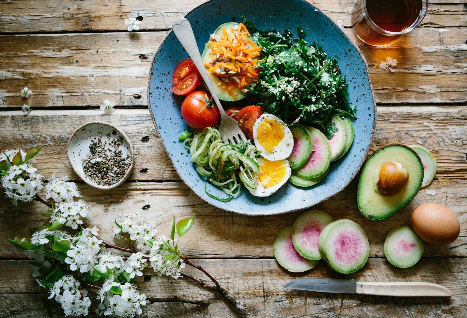 Fresh, colourful nutrient-dense meal styled on a wooden table