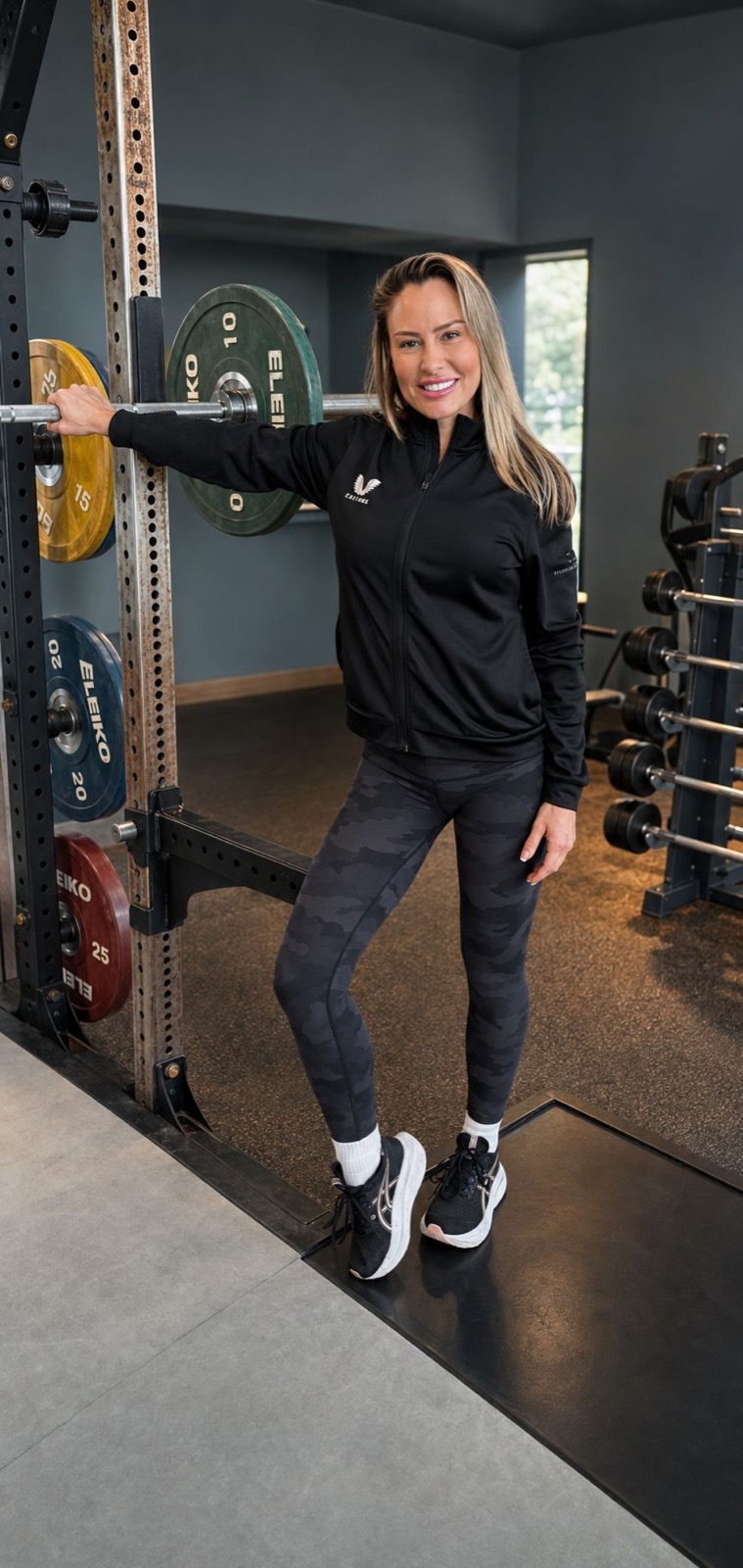 Rebecca in the strength studio at the barbell rack